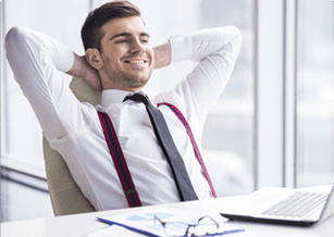 Image of a calm and smiling man on his notebook.